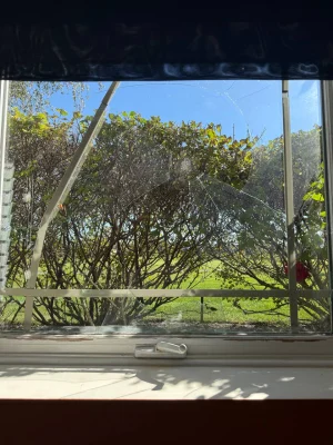 Broken window glass in Lockport