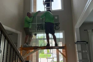 Installing replacement glass above home entryway